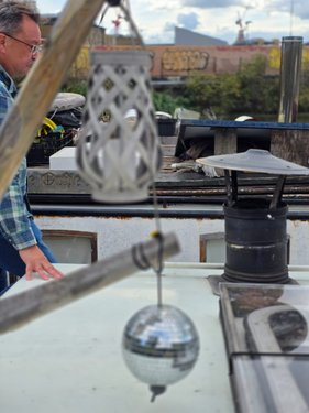 Mark on Jonge Jan with hanging disco ball and lantern.