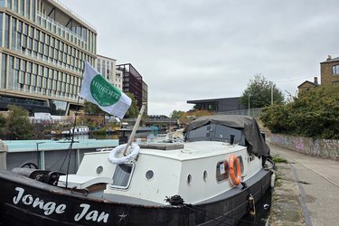 Hideout collective flag on Jonge Jan with buildings in background