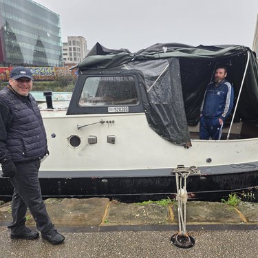 James on canal path and Sean in boat on winters day