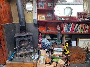 Wood stove and old book shelves